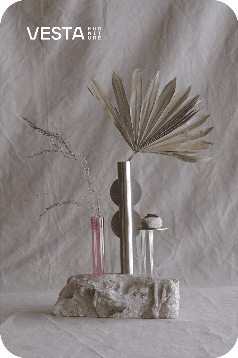 Showroom exhibition of METEORITI B: Stem Botticino marble, stainless steel and borosilicate blown glass vase By VESTA FURNITURE